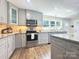 Modern kitchen with granite countertops, stainless steel appliances, and custom cabinets at 1035 15Th Nw Ave, Hickory, NC 28601