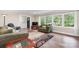 Cozy living room featuring large windows and comfortable seating arrangements at 1035 15Th Nw Ave, Hickory, NC 28601