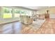 Bright living room featuring large windows, modern flooring, and neutral colored furniture at 1035 15Th Nw Ave, Hickory, NC 28601