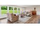 Bright living room with comfortable furnishings, wood flooring and large windows at 1035 15Th Nw Ave, Hickory, NC 28601