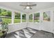 Bright sunroom with natural light, a ceiling fan and views of the surrounding yard at 1035 15Th Nw Ave, Hickory, NC 28601