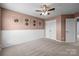 Bedroom features a neutral wall color, white wainscoting, and a ceiling fan with carpet floors at 1035 Ivey Ct, Indian Land, SC 29707