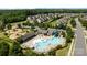 Bird's eye view of community pool, splash pad, lounge chairs, picnic pavilion, and playground at 1035 Ivey Ct, Indian Land, SC 29707