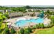 Aerial view of community pool area, slide, splash pad, and plenty of lounge chairs at 1035 Ivey Ct, Indian Land, SC 29707