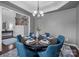 Dining area featuring a chandelier, hardwood floors, and a glimpse of the staircase at 1035 Ivey Ct, Indian Land, SC 29707