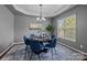 Elegant dining room featuring a modern chandelier and lots of natural light at 1035 Ivey Ct, Indian Land, SC 29707