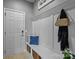 Functional entryway with a built-in bench, storage cubbies, and wall-mounted coat hooks, ideal for organization at 1035 Ivey Ct, Indian Land, SC 29707