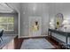 Bright entryway with hardwood floors, a decorative rug, and views to the living room at 1035 Ivey Ct, Indian Land, SC 29707