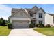 Charming home with a two-car garage, well-maintained lawn, and attractive landscaping at 1035 Ivey Ct, Indian Land, SC 29707
