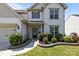 Beautifully landscaped front yard with healthy green grass and attractive shrubbery at 1035 Ivey Ct, Indian Land, SC 29707