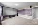 Large home theater features a projector screen, neutral carpet, and theater sound system at 1035 Ivey Ct, Indian Land, SC 29707