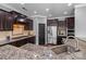 Gourmet kitchen showcasing stainless steel appliances, granite counters, and ample cabinetry at 1035 Ivey Ct, Indian Land, SC 29707