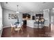 Bright kitchen with a dining nook, hardwood floors, and a kitchen bar at 1035 Ivey Ct, Indian Land, SC 29707