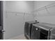 Efficient laundry room featuring modern, front-loading LG washing machine and dryer, and wire shelving at 1035 Ivey Ct, Indian Land, SC 29707