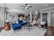 Spacious open-concept area with a living room, kitchen, dining area, staircase, and modern decor at 1035 Ivey Ct, Indian Land, SC 29707