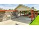 Outdoor picnic area featuring stone accents, built-in grill, and convenient access to a community pool at 1035 Ivey Ct, Indian Land, SC 29707