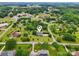 Aerial view of the house with large yard surrounded by greenery and mature trees at 105 Gold Run Ct, Kings Mountain, NC 28086