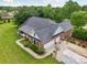Aerial view of brick house featuring dual garage, long driveway, and landscaped yard at 105 Gold Run Ct, Kings Mountain, NC 28086