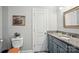 Cozy bathroom featuring granite countertop vanity, toilet, and framed mirror at 105 Gold Run Ct, Kings Mountain, NC 28086