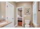 Bathroom with white vanity, marble countertops, and view into bedroom at 105 Gold Run Ct, Kings Mountain, NC 28086