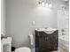Bathroom with modern vanity, faucet, and tiled shower-tub with grab bar at 105 Gold Run Ct, Kings Mountain, NC 28086