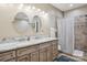 The bathroom has a double sink vanity with granite countertops and a shower with decorative tile at 105 Gold Run Ct, Kings Mountain, NC 28086
