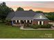 Charming brick home with a welcoming front porch and beautifully landscaped yard at 105 Gold Run Ct, Kings Mountain, NC 28086
