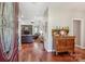 Warm and inviting foyer featuring hardwood floors, a decorative cabinet, and a glimpse into the living area at 105 Gold Run Ct, Kings Mountain, NC 28086