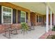 Inviting front porch with rocking chairs, creating a cozy and welcoming outdoor space at 105 Gold Run Ct, Kings Mountain, NC 28086