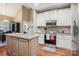 Kitchen with white cabinets, stainless appliances, granite countertops, and hardwood floors at 105 Gold Run Ct, Kings Mountain, NC 28086