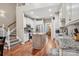 Open concept kitchen with hardwood floors, an island, and stainless steel appliances at 105 Gold Run Ct, Kings Mountain, NC 28086