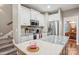 Kitchen with granite countertops, an island, stainless steel appliances, and white cabinets at 105 Gold Run Ct, Kings Mountain, NC 28086