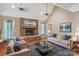 Spacious living room with a stone fireplace, vaulted ceilings, and comfortable seating arrangements at 105 Gold Run Ct, Kings Mountain, NC 28086