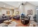 Cozy living room featuring comfortable leather furniture, warm lighting, and a relaxed atmosphere at 105 Gold Run Ct, Kings Mountain, NC 28086