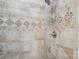 Close up of the shower with decorative tiling and a mounted shower caddy at 105 Gold Run Ct, Kings Mountain, NC 28086
