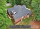 A high-angle image showcases a new roof, installed in 2024, made of architectural shingles with a 30-year warranty at 105 Prairie Rose Ct, Waxhaw, NC 28173
