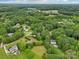 Scenic aerial view showcases the home's location near parks, surrounded by lush greenery and mature trees at 105 Prairie Rose Ct, Waxhaw, NC 28173