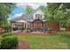 Spacious backyard with a stone patio, pergola, and outdoor seating area perfect for entertaining guests at 105 Prairie Rose Ct, Waxhaw, NC 28173