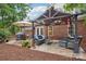 Outdoor patio area with pergola and ample seating, ideal for relaxation and gatherings at 105 Prairie Rose Ct, Waxhaw, NC 28173