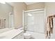 Well-lit bathroom with a shower over tub, white vanity, and neutral walls at 105 Prairie Rose Ct, Waxhaw, NC 28173