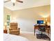 Bright bedroom with carpet, ceiling fan, desk, and a comfortable reading chair at 105 Prairie Rose Ct, Waxhaw, NC 28173