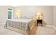 Comfortable bedroom featuring neutral tones, carpet, and bedside lamps at 105 Prairie Rose Ct, Waxhaw, NC 28173
