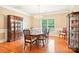 Dining room features hardwood floors, chandelier, and a china cabinet at 105 Prairie Rose Ct, Waxhaw, NC 28173