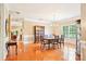Formal dining room with hardwood floors, chandelier, and plenty of natural light at 105 Prairie Rose Ct, Waxhaw, NC 28173
