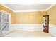Empty room with chair railing, crown molding, and lots of natural light at 105 Prairie Rose Ct, Waxhaw, NC 28173