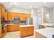 Bright kitchen features stainless steel appliances, tile backsplash, and a center island at 105 Prairie Rose Ct, Waxhaw, NC 28173