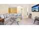Inviting living room featuring a comfortable gray sofa, decorative pillows, and a glass coffee table at 105 Prairie Rose Ct, Waxhaw, NC 28173