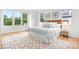 Bright bedroom with large windows, wood floors, and contemporary decor at 106 Arbor Dr, Waxhaw, NC 28173