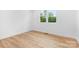 Minimalist bedroom with hardwood floors and natural light at 106 Arbor Dr, Waxhaw, NC 28173
