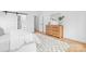 Modern bedroom with light wood floors and a barn door closet at 106 Arbor Dr, Waxhaw, NC 28173